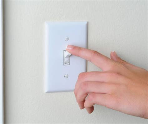 touching light switch feels electric